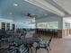 Relaxing pool area with covered seating and tables at 3413 Pennyroyal Rd, Port Charlotte, FL 33953