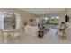 Living room with view of patio and pool area at 3413 Pennyroyal Rd, Port Charlotte, FL 33953