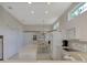 Spacious kitchen with white cabinets, island, and appliances at 3413 Pennyroyal Rd, Port Charlotte, FL 33953