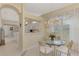 Kitchen features breakfast nook and view into living room at 3413 Pennyroyal Rd, Port Charlotte, FL 33953