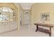 Bright entryway with built-in shelving and stained glass at 3413 Pennyroyal Rd, Port Charlotte, FL 33953