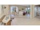 Living room with tiled floors and access to a patio at 3413 Pennyroyal Rd, Port Charlotte, FL 33953