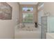 Relaxing bathroom with a jetted tub and built in cabinetry at 3413 Pennyroyal Rd, Port Charlotte, FL 33953