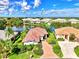 Aerial view of houses near a lake at 3413 Pennyroyal Rd, Port Charlotte, FL 33953
