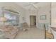 Bright home office with built in shelving and seating area at 3413 Pennyroyal Rd, Port Charlotte, FL 33953