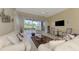 Living room with access to the patio and pool at 3413 Pennyroyal Rd, Port Charlotte, FL 33953