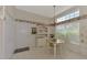 Kitchen with a breakfast nook and view into living room at 3413 Pennyroyal Rd, Port Charlotte, FL 33953