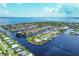 Aerial view of waterfront homes and properties along a canal at 292 Stebbins Se Ter, Port Charlotte, FL 33952