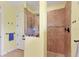 Spa-like shower with neutral tile and multiple shower heads at 15608 Lakeland Cir, Port Charlotte, FL 33981
