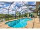 Inviting screened pool and spa area at 15608 Lakeland Cir, Port Charlotte, FL 33981