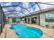 Large screened pool with spa and patio at 15608 Lakeland Cir, Port Charlotte, FL 33981