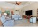 Spacious living area with comfortable seating and large TV at 15608 Lakeland Cir, Port Charlotte, FL 33981