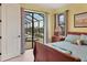 Serene bedroom with pool and spa access, featuring a queen-size bed and water views at 15608 Lakeland Cir, Port Charlotte, FL 33981
