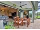Covered patio with dining area and pool view at 15608 Lakeland Cir, Port Charlotte, FL 33981