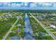 Broad aerial showcasing the neighborhood's waterfront canal system at 15608 Lakeland Cir, Port Charlotte, FL 33981