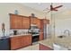 Well-equipped kitchen boasting stainless steel appliances and granite countertops at 15608 Lakeland Cir, Port Charlotte, FL 33981