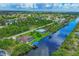 Extensive aerial view of waterfront community and surrounding area at 15608 Lakeland Cir, Port Charlotte, FL 33981