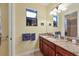 Well-appointed bathroom with granite countertop and ample storage at 15608 Lakeland Cir, Port Charlotte, FL 33981