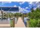 Covered boat dock with lift providing convenient water access at 15608 Lakeland Cir, Port Charlotte, FL 33981
