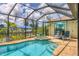 Screened pool and spa with canal views at 15608 Lakeland Cir, Port Charlotte, FL 33981
