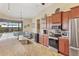 Kitchen with granite countertops, stainless steel appliances and breakfast bar at 15608 Lakeland Cir, Port Charlotte, FL 33981