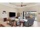 Relaxing living room featuring sliding doors to pool area at 15608 Lakeland Cir, Port Charlotte, FL 33981