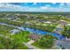 Waterfront property with canal access and surrounding homes at 15608 Lakeland Cir, Port Charlotte, FL 33981