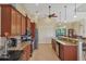 Open kitchen with granite counters, stainless steel appliances and breakfast bar at 15608 Lakeland Cir, Port Charlotte, FL 33981