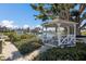 Charming gazebo overlooking the waterfront with benches for relaxing at 11000 Placida Rd # 2303, Placida, FL 33946