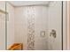 Large walk-in shower with pebble tile accents and built-in bench at 11000 Placida Rd # 2303, Placida, FL 33946