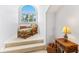 Cozy sitting area with wicker chairs and ottoman near a stairway at 11000 Placida Rd # 2303, Placida, FL 33946
