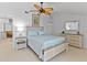 Light and airy bedroom with ceiling fan and built-in dresser at 11000 Placida Rd # 2303, Placida, FL 33946