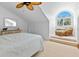 Bright bedroom with a large window, comfy chair, and ceiling fan at 11000 Placida Rd # 2303, Placida, FL 33946