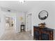 Bright entryway with tile flooring, decorative console table, and view to staircase at 11000 Placida Rd # 2303, Placida, FL 33946
