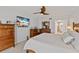Main bedroom with king-size bed, dresser, and ensuite bathroom at 11000 Placida Rd # 2303, Placida, FL 33946