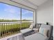 Relaxing waterfront balcony with lounge chairs, offering stunning water views at 11160 Hacienda Del Mar Blvd # D-205, Placida, FL 33946