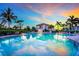 Inviting community pool with a surrounding patio and sunset views at 11160 Hacienda Del Mar Blvd # D-205, Placida, FL 33946