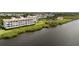 Aerial view of condo building on the waterfront at 11160 Hacienda Del Mar Blvd # D-205, Placida, FL 33946