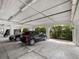 Covered parking garage with several cars parked at 11160 Hacienda Del Mar Blvd # D-205, Placida, FL 33946