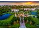 Aerial view of community at sunset with tennis courts at 11160 Hacienda Del Mar Blvd # D-205, Placida, FL 33946