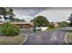 View of building and surrounding grounds, showing the community setting at 8 Quails Run Blvd # 10, Englewood, FL 34223