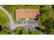 Aerial view of the building, showing the layout and parking lot at 8 Quails Run Blvd # 10, Englewood, FL 34223