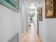 Hallway with light walls and tiled floors at 8 Quails Run Blvd # 10, Englewood, FL 34223