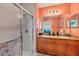 Double vanity, granite countertop and a walk-in shower in this bathroom at 8413 Placida Rd # 407, Placida, FL 33946