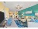 Open concept living room with dining area and view into kitchen at 8413 Placida Rd # 407, Placida, FL 33946