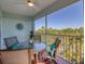 Enjoy serene views from this screened lanai, complete with a table and chairs at 8413 Placida Rd # 407, Placida, FL 33946