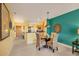 Bright dining area with glass-top table and wicker chairs at 8413 Placida Rd # 407, Placida, FL 33946