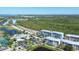Aerial view of community, highlighting resort-style amenities and coastal views at 8413 Placida Rd # 407, Placida, FL 33946