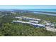 Aerial view of community highlighting building layout and lush surroundings at 8413 Placida Rd # 407, Placida, FL 33946