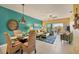 Spacious living room with coastal decor, tiled floors and access to balcony at 8413 Placida Rd # 407, Placida, FL 33946